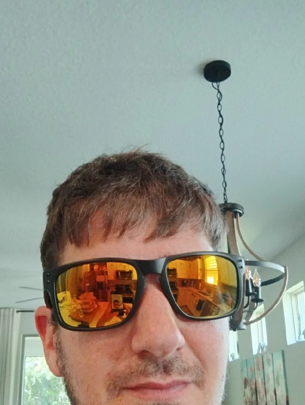 Oakley Matte Black Sunglasses with Yellow-Orange Mirror Lenses